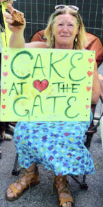A woman with cake at a 'Cake at the Gate' event at Broadford bridge