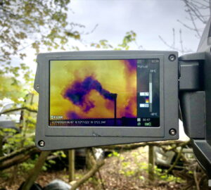 A camera screen showing methane emissions from a flare stack